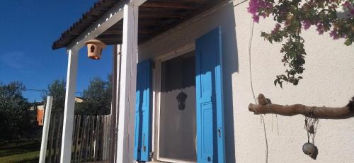 a blue door on a house with a porch at La collina sui trabocchi in Ortona