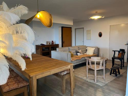 Predel za sedenje v nastanitvi Aprile des îles .Appartement avec une jolie vue