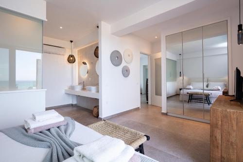 a bedroom with a bed and a bathroom at Feyre Boutique Mansion in Magnisía