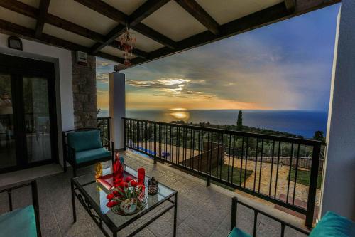 a balcony with a view of the ocean at Villa Vera in Agios Nikitas