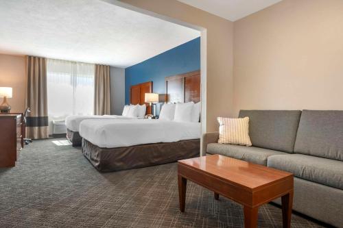 a hotel room with a bed and a couch at Comfort Inn & Suites Beaver - Interstate 15 North in Beaver