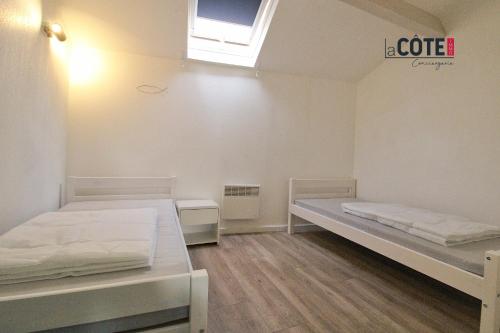 Tempat tidur dalam kamar di LA MER - 6 COUCHAGES