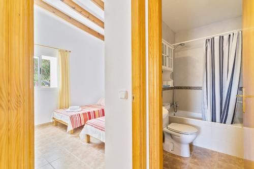 a bathroom with a toilet and a sink at Can Juan De S'Hereu in Sant Francesc Xavier