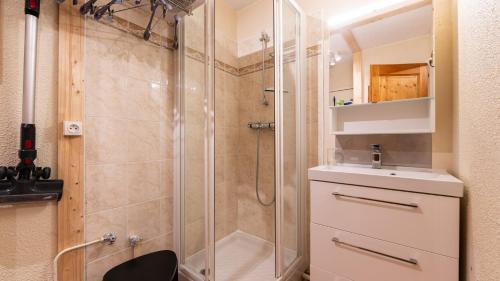 a bathroom with a shower and a sink at Grande Neige 44 - Appt renove 4 pers in Morillon