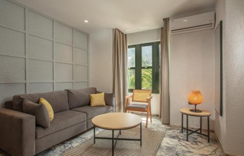 a living room with a couch and a table at Grand Aquarium in Marmaris