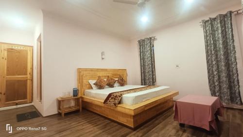 a bedroom with a large bed in a room at Moonshine Home stay in Srinagar