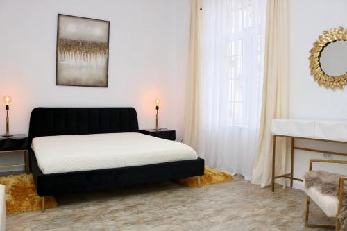 a bedroom with a bed and a fireplace at Herman Apartment Cisnadie in Cisnădie