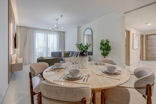 a dining room with a table and chairs at #54 High End 2BR in Mirdif hills in Dubai