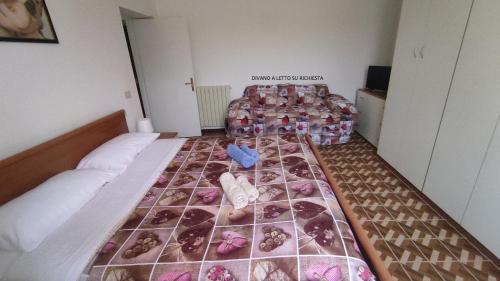 a bedroom with a bed with donuts on it at Appartamento Via Ponchielli in Perugia