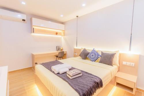 Sky Park Condotel & Residence tesisinde bir odada yatak veya yataklar