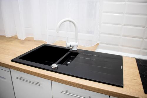 Dapur atau dapur kecil di Leister Apartment Cisnadie