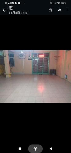 a large room with a gate and a tile floor at Homestay 5095 bandar Putra Kulai Johor in Kulai