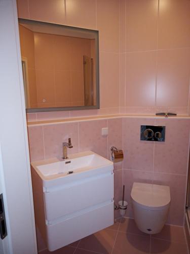 a bathroom with a sink and a toilet at Villa Rosali Boutique Hotel in Hamburg