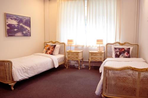 Кровать или кровати в номере Boutique Hotel Postgården
