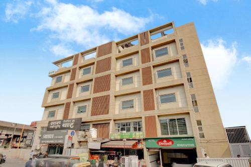 a tall building on a city street at Hotel Deepali Executive in Aurangabad