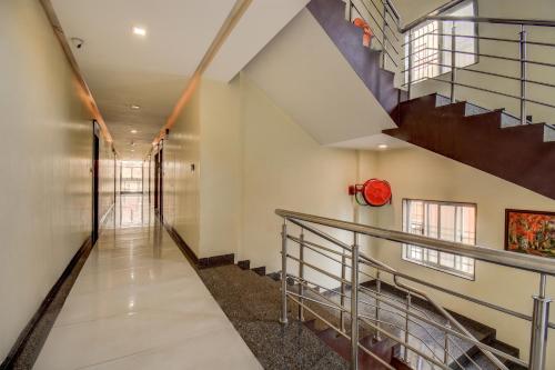a staircase in a building with a stair case at Hotel Deepali Executive in Aurangabad