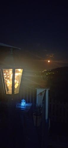 a night time picture of a house with a window at La collina sui trabocchi in Ortona