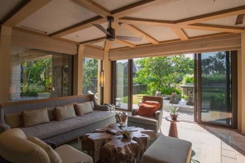 a living room with a couch and a table at The Ritz-Carlton Bali in Nusa Dua