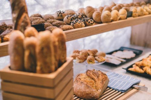 a display of different types of bread and pastries at Posthotel Achenkirch Resort and Spa - Adults Only in Achenkirch