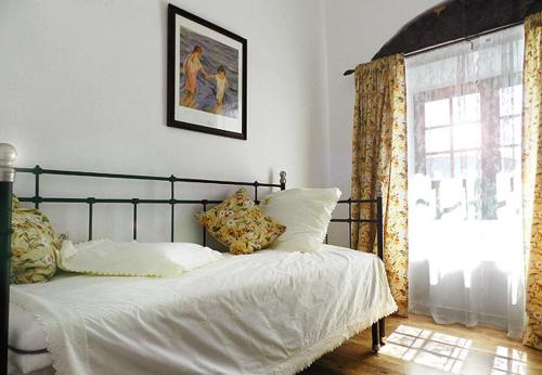 Ένα ή περισσότερα κρεβάτια σε δωμάτιο στο Casa Emerenciana