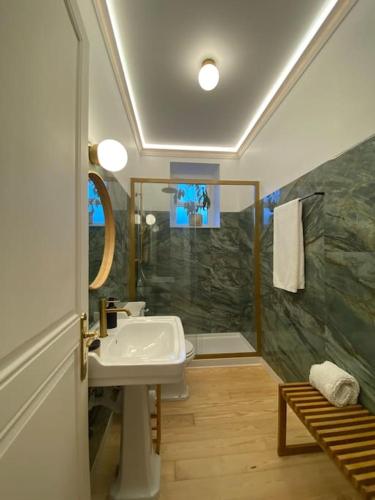 a bathroom with a sink and a shower at Sintra Clássica in Sintra