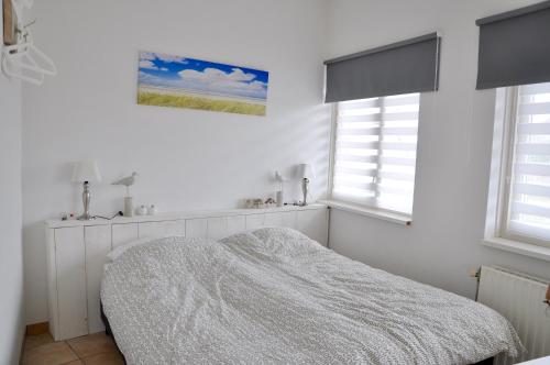 Postel nebo postele na pokoji v ubytování Wijde Blick 104