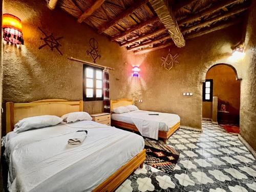 Ένα ή περισσότερα κρεβάτια σε δωμάτιο στο Hotel Camping Les Roses Des Dunes & Piscine