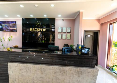 a bar at a hotel with a reception desk at Residence Riverside in Galaţi