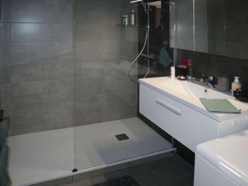 a shower with a glass door next to a sink at Appartement Les Orres, 2 pièces, 6 personnes - FR-1-322-531 in Les Orres