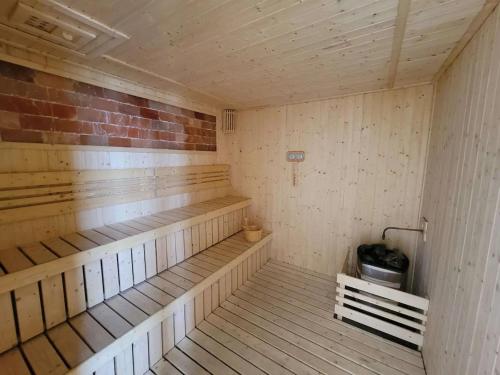 an empty sauna with wooden benches in a room at Bukit Bintang Axon Residences 3R2B 3Queens Beds in Kuala Lumpur