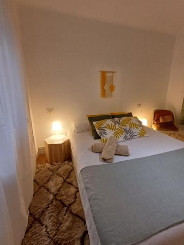 a bedroom with a large bed with a lamp on it at SWEET HOME BILBAO in Bilbao
