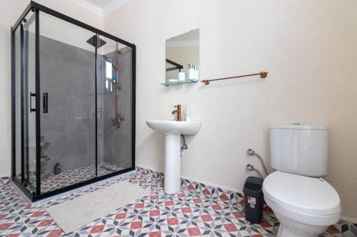 a bathroom with a shower and a toilet and a sink at Soft & Historic 3BR Home w/ Iconic Haydarpaşa View in Istanbul
