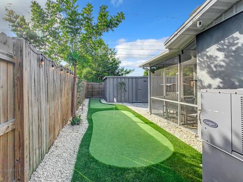 a backyard with a miniature golf course at AMI, IMG, Dogsitting, Boats, Snorkeling, Fishing, Beach, Bikes, Golf, Hottub, BBQ, SRQ in Bradenton