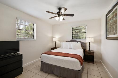 a bedroom with a bed and a ceiling fan at 3 bedroom House with Renovated kitchen and bath! in Cocoa