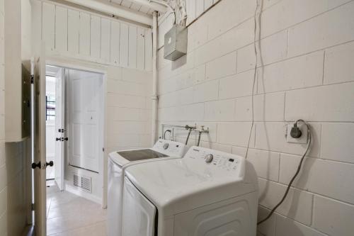 a white laundry room with a washer and dryer at 3 bedroom House with Renovated kitchen and bath! in Cocoa
