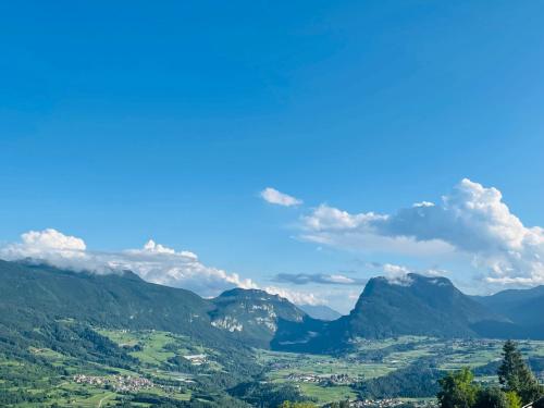 a view of a valley in the mountains at Maso Azzurro Chalet in Stenico