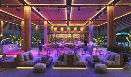 a lobby with couches and a bar in a building at Megasaray Club Belek in Belek