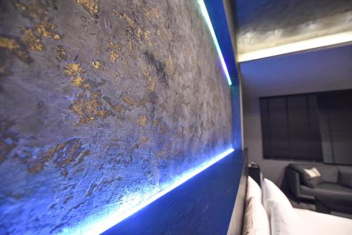 a close up of a scratched up wall in a room at Two Couples Leisure Art Motel in Tainan