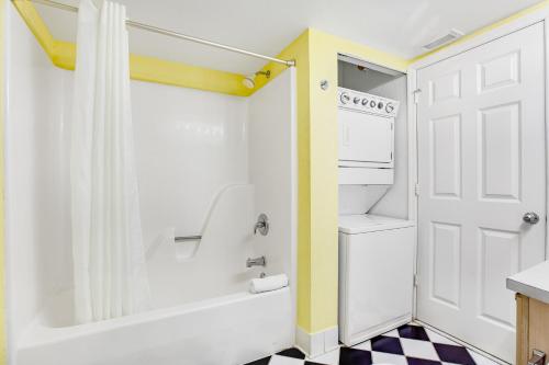 a bathroom with a shower and a sink and a toilet at Sunrise Suites - Saint Kitts 412 in Key West