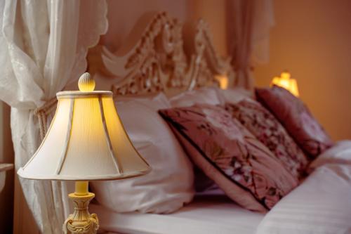 Кровать или кровати в номере Boutique Hotel Postgården