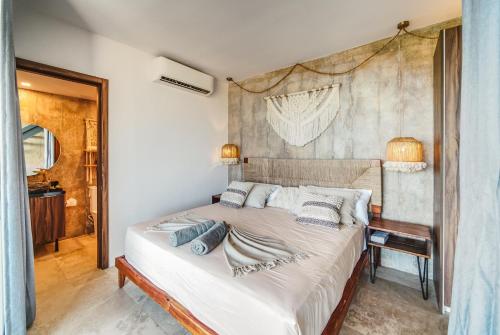 a bedroom with a large bed in a room at Tulum Paradise - Penthouse with Private Pool and Cenote in Tulum