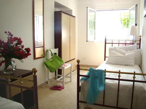 Ein Bett oder Betten in einem Zimmer der Unterkunft Le Dimore di Chiara