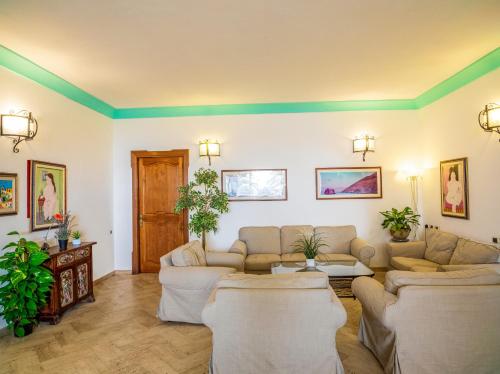 a living room with couches and a table at Hotel Ossidiana Stromboli Center in Stromboli