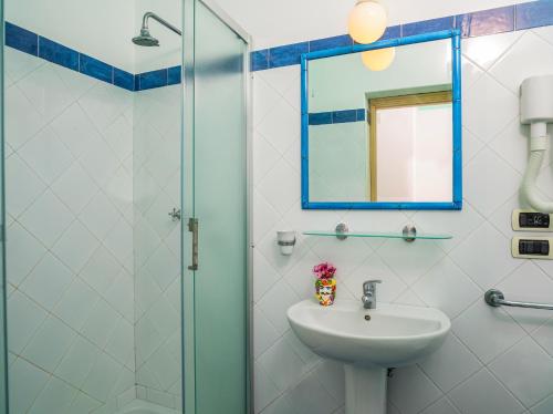 a bathroom with a sink and a shower at Hotel Ossidiana Stromboli Center in Stromboli