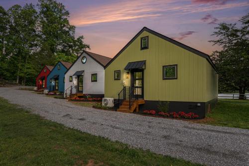 a group of houses sitting on a gravel road at Tranquille Resort in Hiawassee