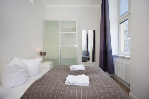 Postel nebo postele na pokoji v ubytování Celebration Flat by Ruterra