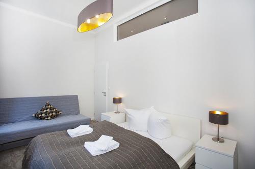 Postel nebo postele na pokoji v ubytování Celebration Flat by Ruterra
