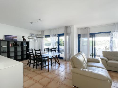 a living room and dining room with a table and chairs at Villa Emilia by Best Holidays Fuerteventura in Corralejo