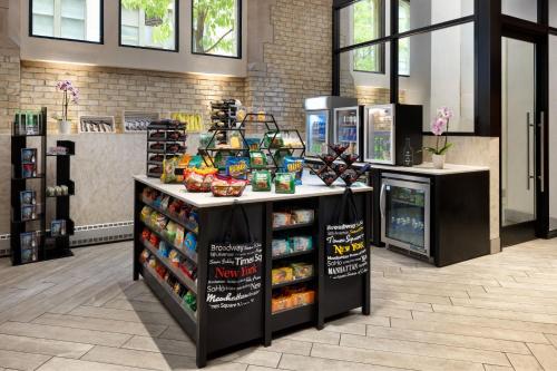 a store with a counter with food on it at SpringHill Suites by Marriott New York Manhattan/Times Square South in New York