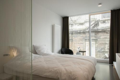 Un pat sau paturi într-o cameră la Hotel Muske Pitter